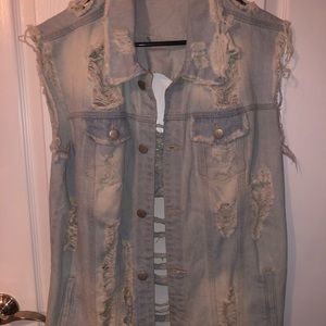 Oversized distressed jean vest.